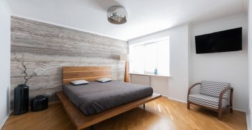 an hotel room with window, grey bedsheet, chandelier, wood flooring, free stock photo