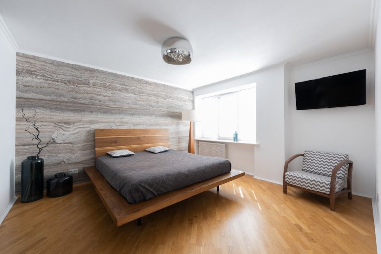 an hotel room with window, grey bedsheet, chandelier, wood flooring, free stock photo